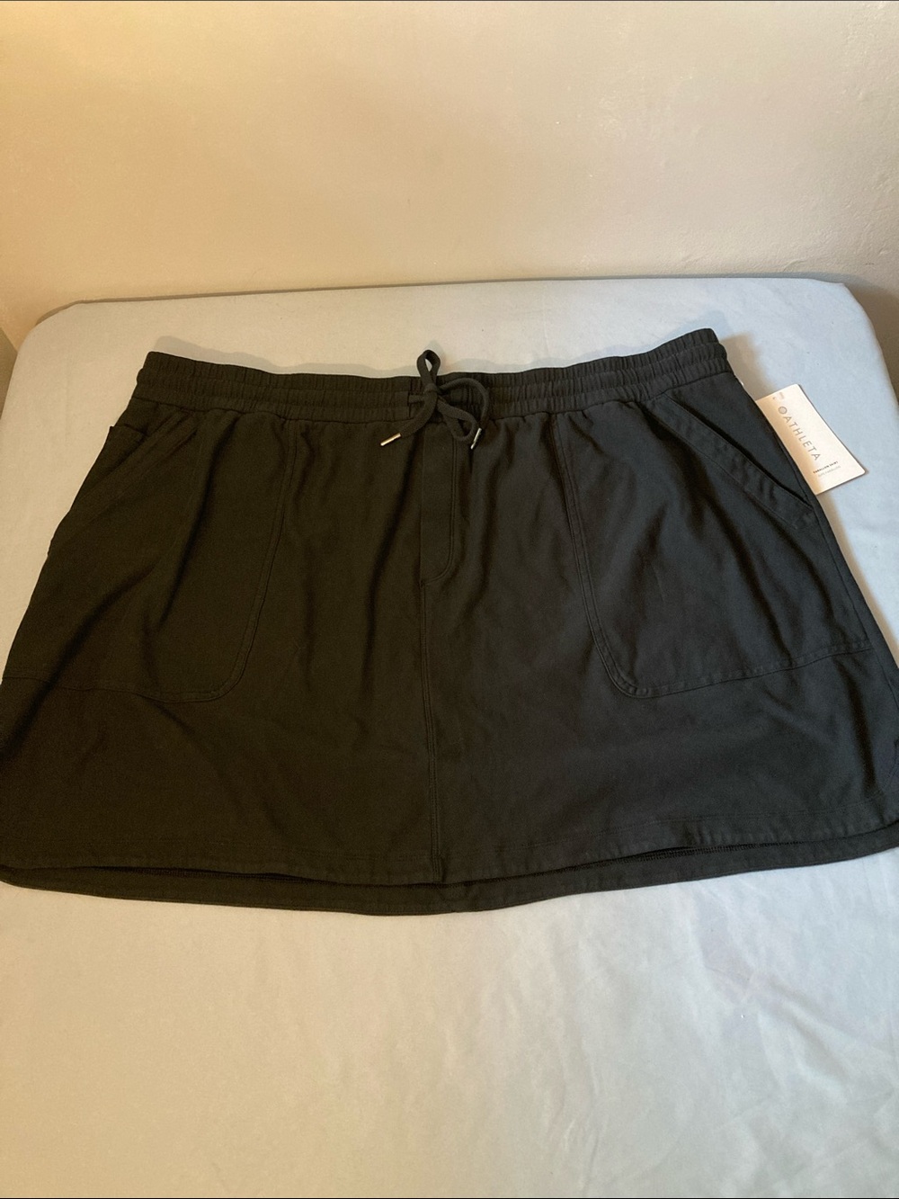 Athleta Black Drawstring Pull-On Mini Skirt with Pockets